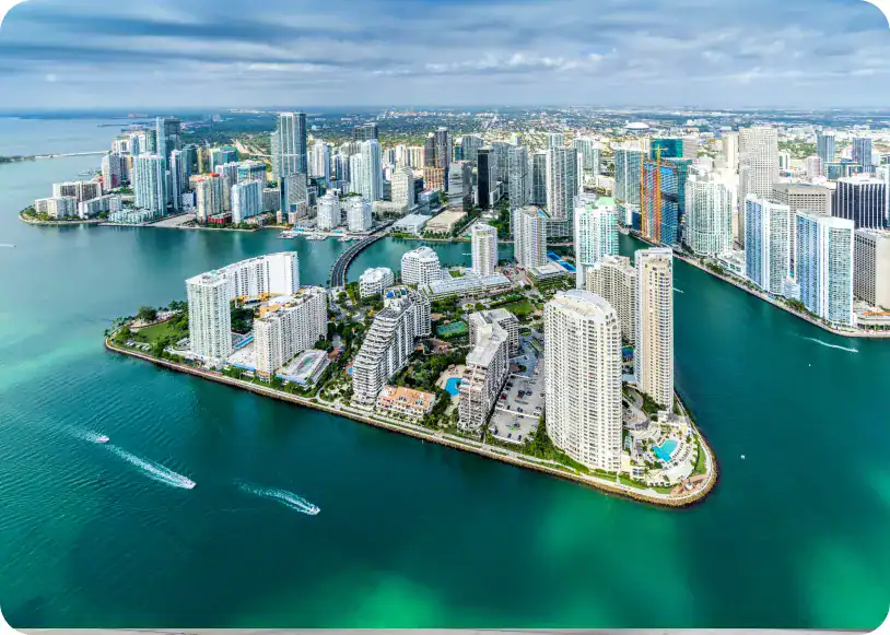 Modern Miami skyline with high-rise buildings and waterfront views, showcasing vibrant urban development.