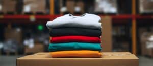 Stack of multi coloured Fashion and Apparel boxes on a carton with the warehouse shelves in the background